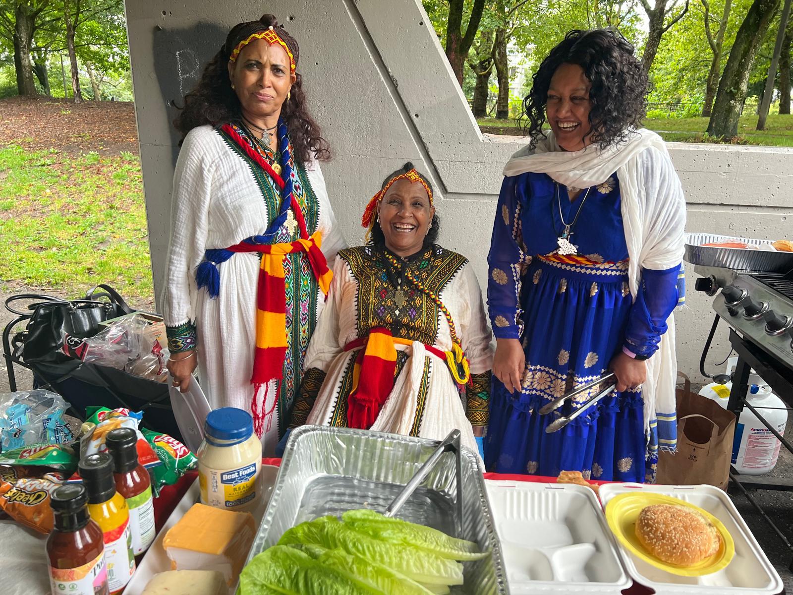 Community elders in vibrant traditional Tigrayan attire at a gathering